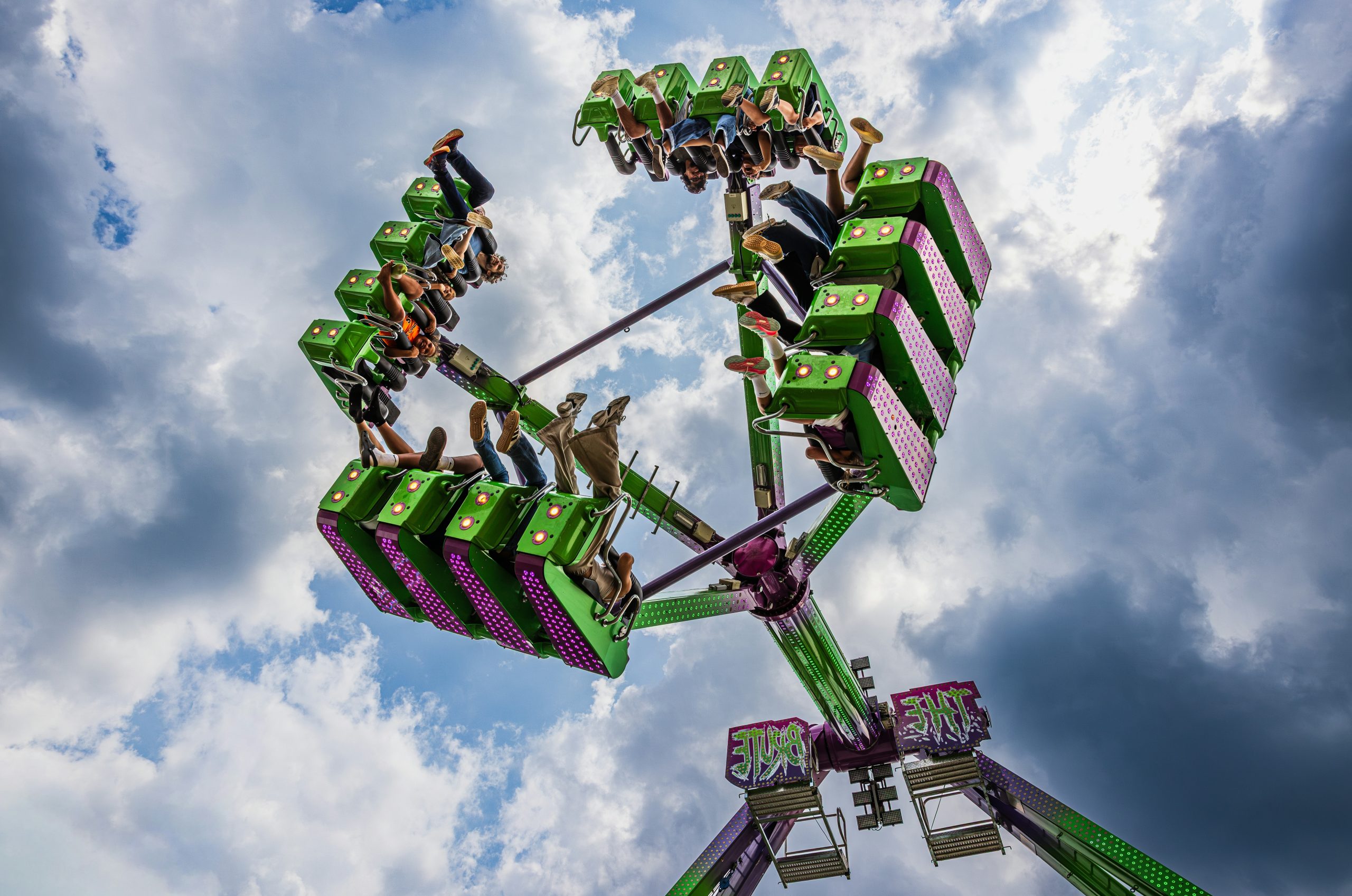 Crimson People Riding A Green