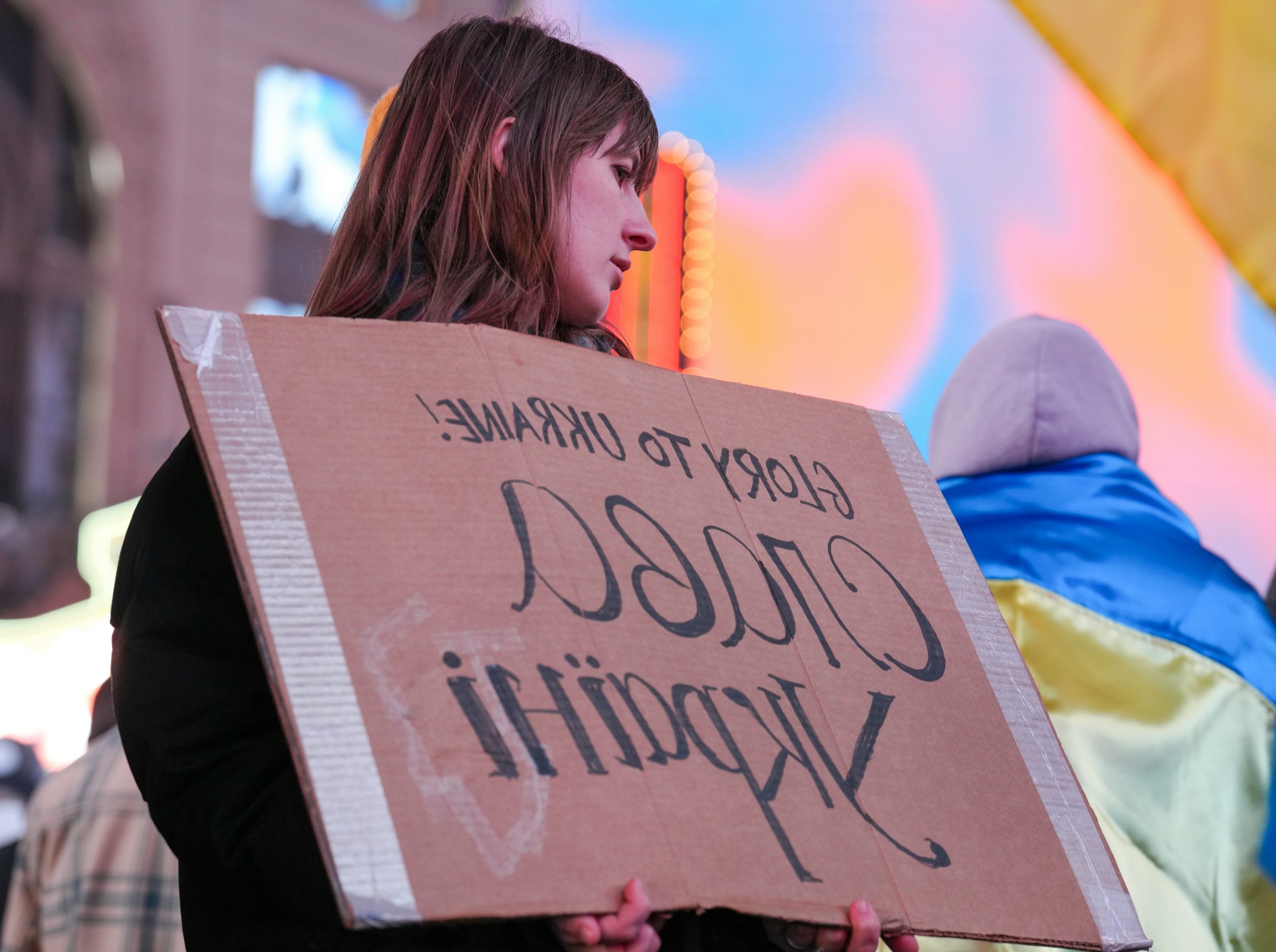 Golden Woman Holding A Cardboard
