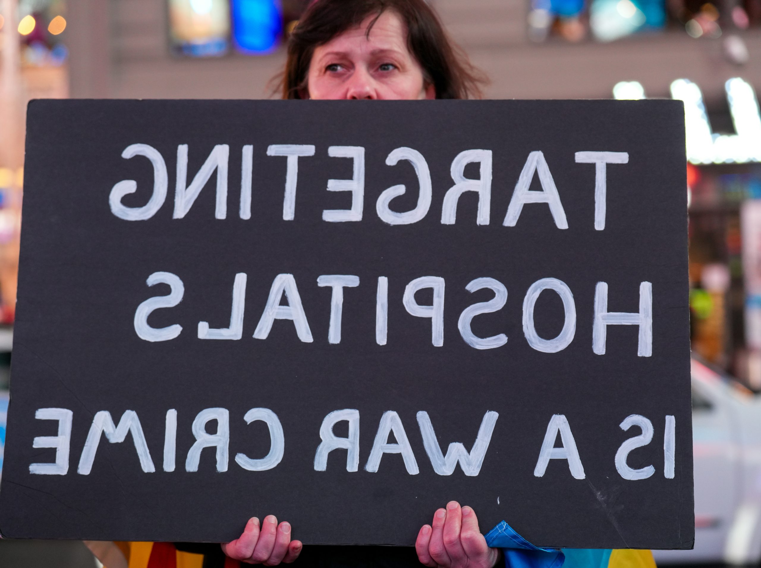 Dawnlit Woman Holding A Sign