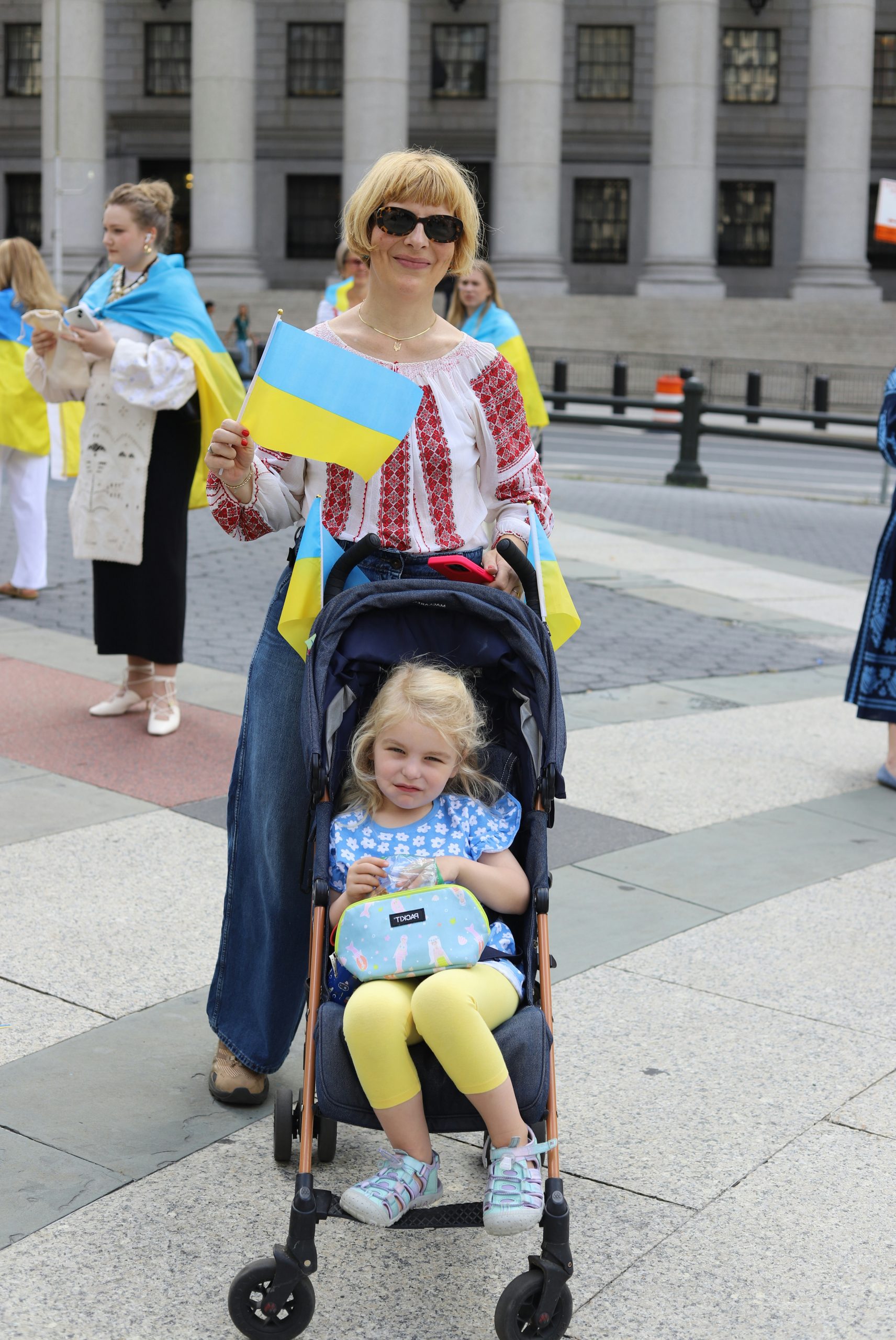 Crimson Woman Holding A Ukrainian
