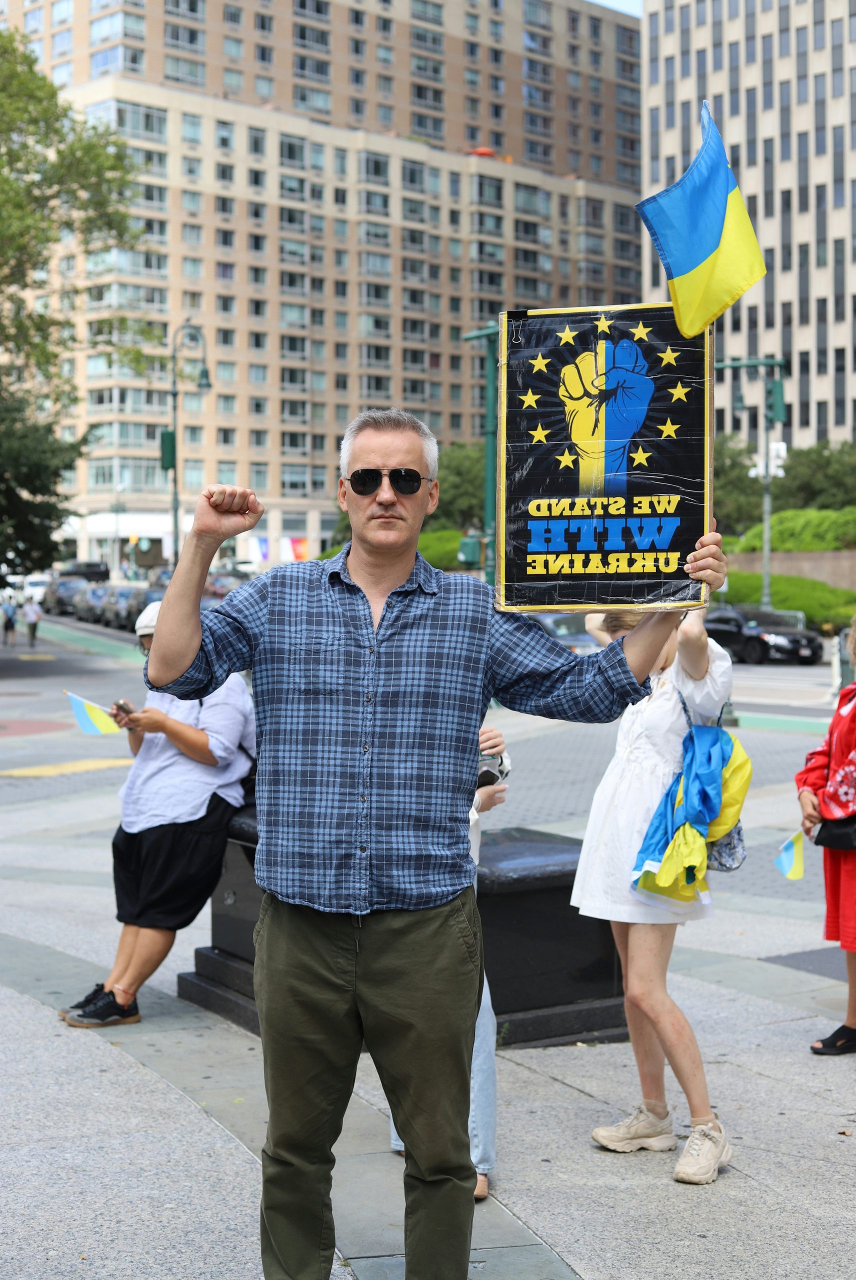 Untamed Man Holding A Sign