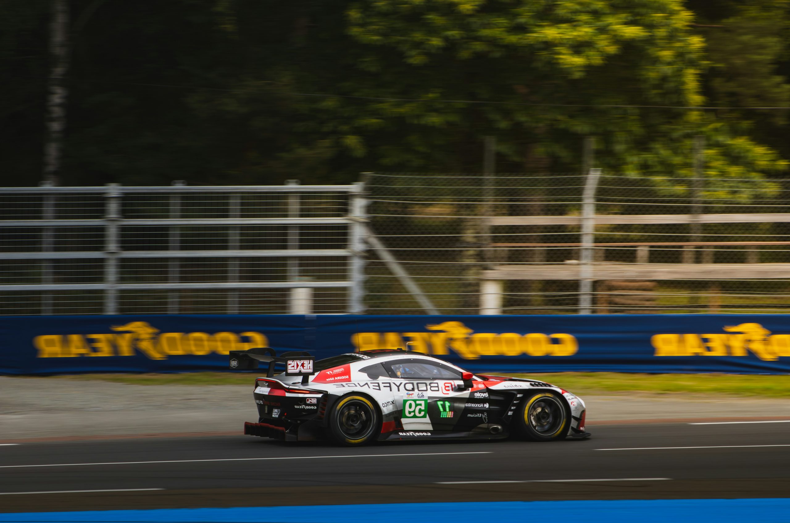 Cobalt Race Car Speeding Past