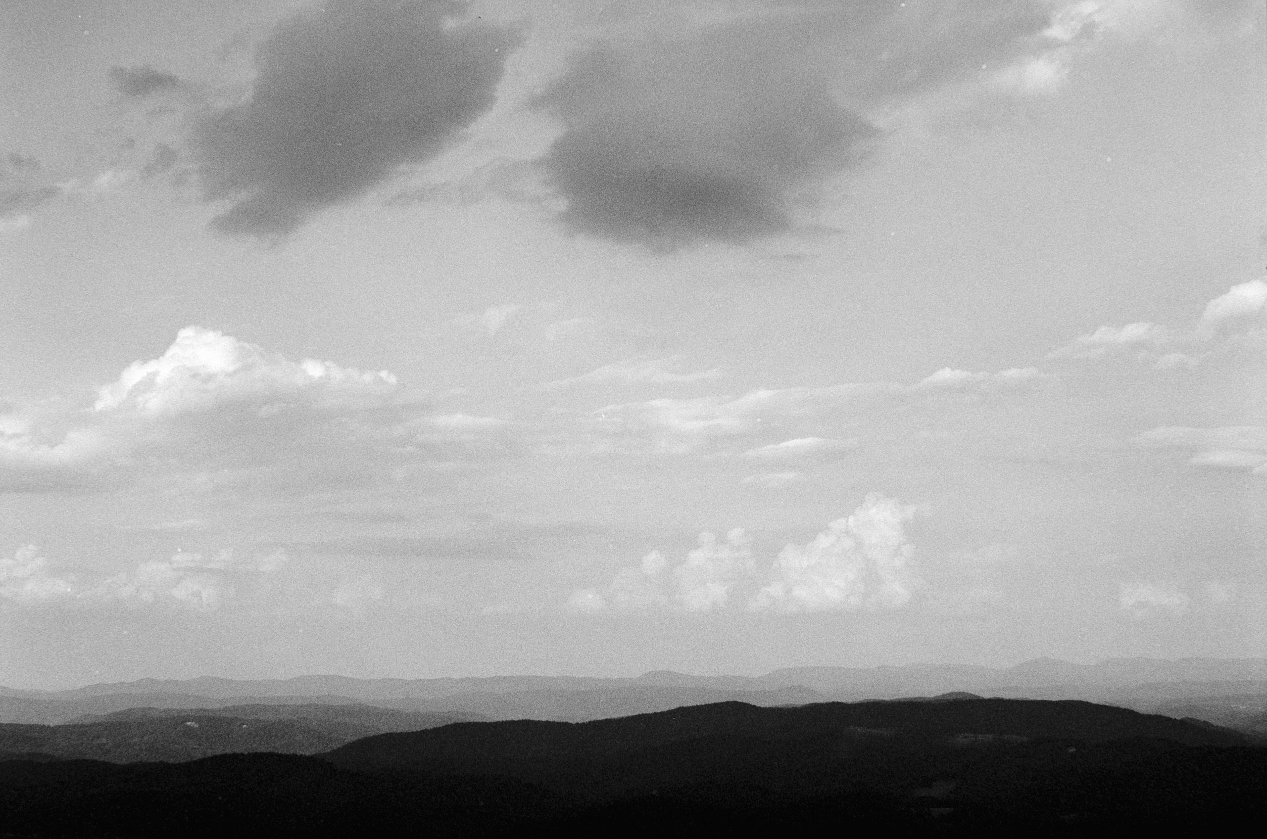 Crimson Layered Mountain Ridges Fading