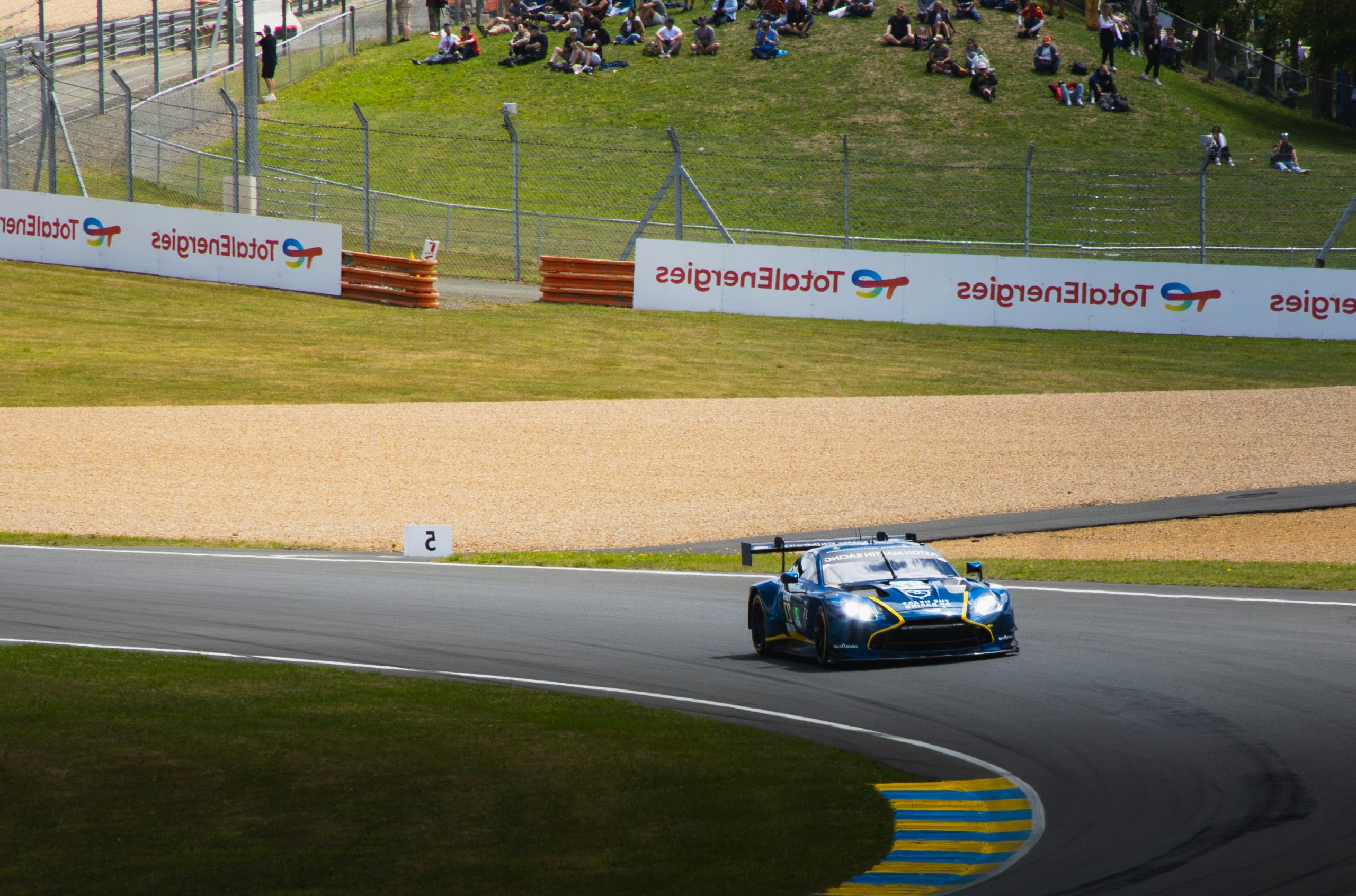 Glowing Blue Race Car Speeding