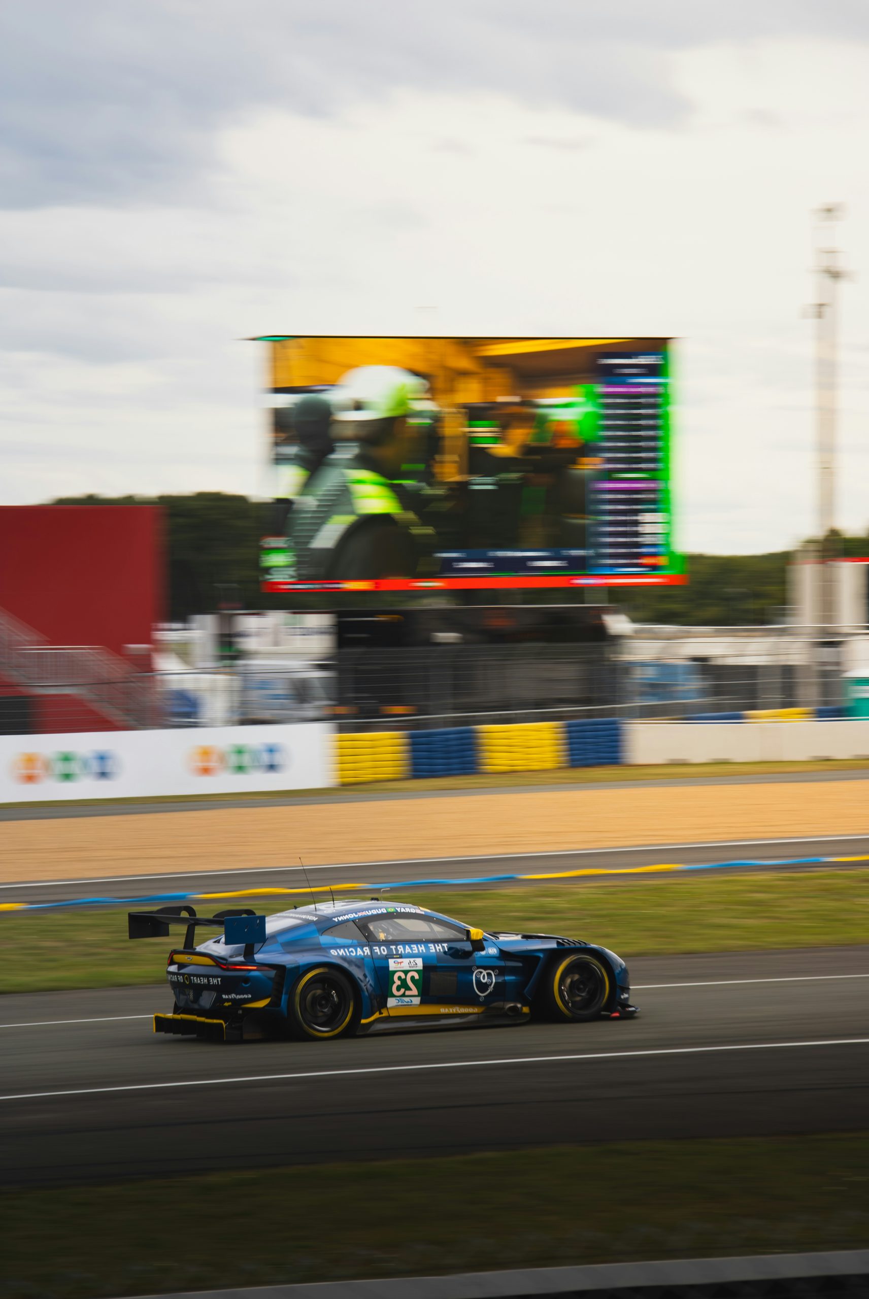 Smoldering Blue Race Car Speeding